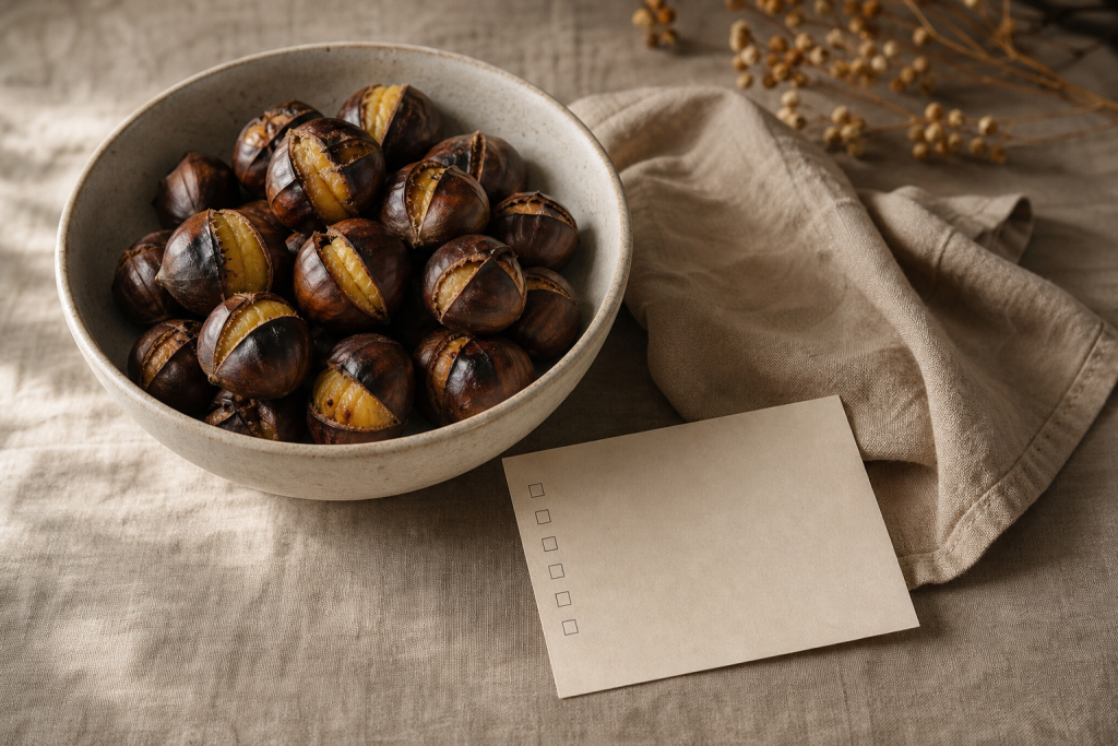 Castagne arrostite in una ciotola su un tavolo di cucina